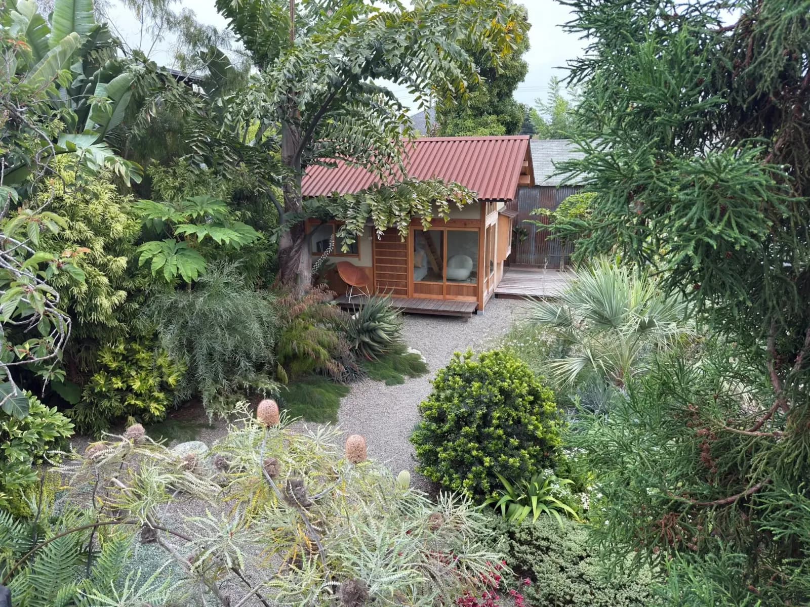 Flora Grubb's home garden with a tea house and exotic plants